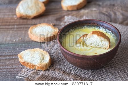 Bowl Of Cheese Dip With Toasts