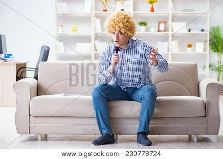 Funny man singing songs in karaoke at home