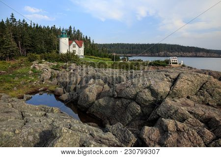 Little River Lighthouse With Rocks And Water
