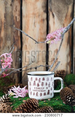 White Ceramic Cup Of Coffee On On Rustic Wooden Background With Cones And Hyacinth. Toned. Spring Po
