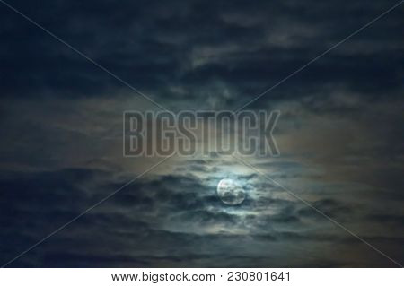 Moon In A Cloudy Sky.
Night, Slightly Cloudy Sky. The Clouds Are Arranged In Parallel Layers. Behind