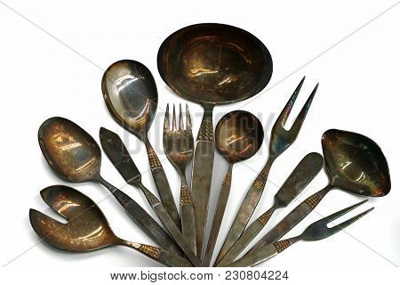 Old Silver Cutlery Arranged In A Circle Isolated On White Background
