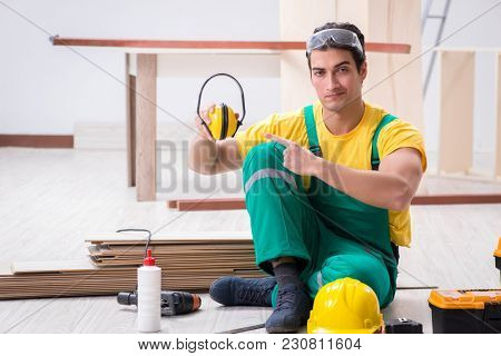 Worker showing the importnace of wearing noise cancelling headph