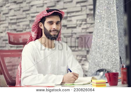 Arabian Business Man Working On Laptop In The Office.