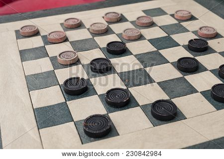 Checkers Game In Public On Sidewalk, Step Up And Take A Seat To Play The Game With A Friend Or Stran