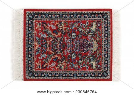 Table mat for hot drinks looking like a carpet, isolated on white