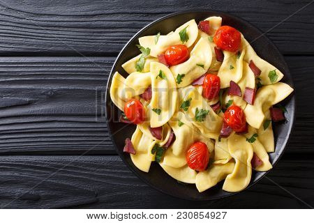 Italian Dumplings Casoncelli Stuffed With Ham With Cherry Tomatoes Close-up On A Plate. Horizontal T