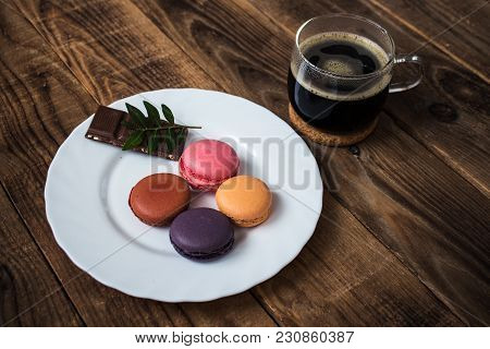 Cup Of Coffee And Macarons And Chocolate