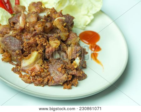 Fried Sour Pork, Fermented Pork With Sauce, Vegetable And Chili On Dish. Sour Pork Is Faverite Prese