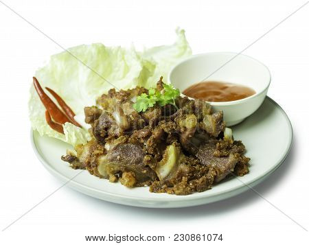 Fried Sour Pork, Fermented Pork With Sauce, Vegetable And Chili On Dish Isolated On White Background