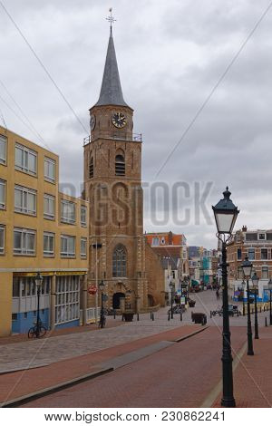 SCHEVENINGEN, THE HAGUE, NETHERLANDS - JANUARY 3, 2017: View to the Oude Kerk, Old Church on Keizerstraat. Built in the mid 15th century, the church was restored in 1957-1959