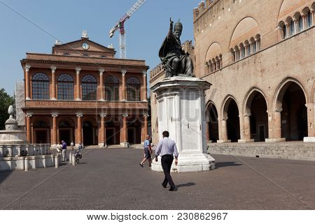 RIMINI, ITALY - JUNE 13, 2017: People on Piazza Cavour at the monument to Pope Paul V. The monument was installed here in 1614