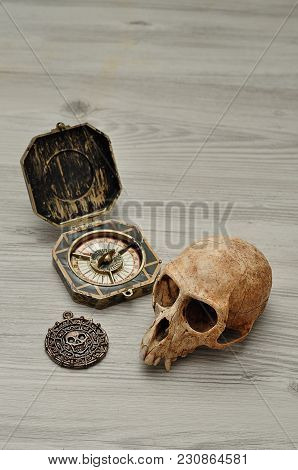 A Compass And A Pirate Coin Toy For A Pirate Game With A Monkey Skull