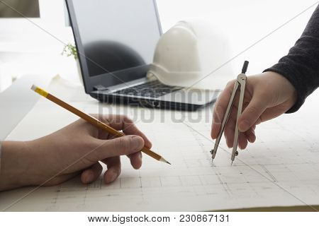 Architects Working On Blueprint. Architects Workplace - Architectural Project, Blueprints, Ruler, Ca