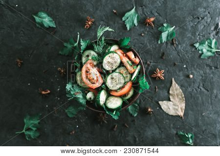 Fresh Salad With Vegetables On A Black Matte Background. The Concept Of A Healthy Diet.