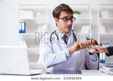 Doctor in corruption concept with being offered bribe