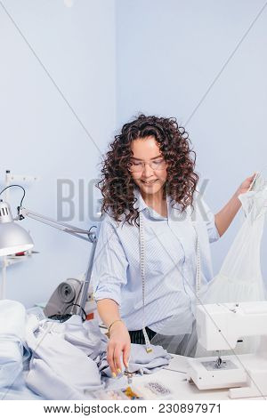 Dressmaker Looking For Beads On Messy Table. Tools For Tailor. Artistic Mess. Useful Things For Tail