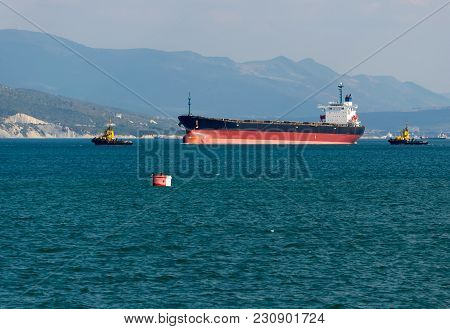 Cargo Ship Anchored In The Roadstead Tsemes Bay At The Entrance Of The Port Of Novorossiysk, Russia