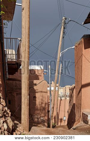 Houses Of Mud Brick, Plastered With Red Clay, On A Deserted Narrow Street In Abyaneh Village, Isfaha