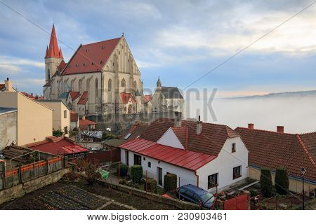 St. Nicholas Deanery Church, Built In 1348, On The Steep Bank Of The Thaya River, Shot On A Foggy Wi