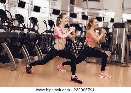 Woman And Girl In Sportswear Doing Aerobical Exercises At The Gym. They Look Happy, Fashionable And 