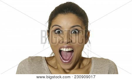 Head Portrait Of Young Happy And Excited Hispanic Woman 30s In Surprise And Astonished Face Expressi