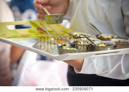 Waiter Holding Plate With Tasty Mussels, Close Up View
