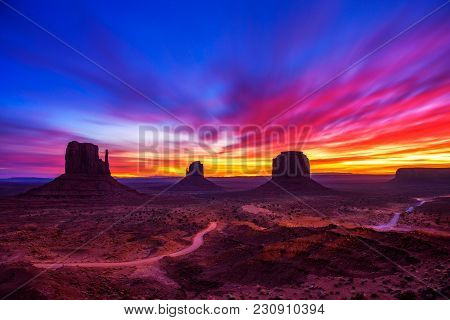Dramatic And Very Colorful Sunrise Over Monument Valley In Arizona, Usa. Long Exposure.