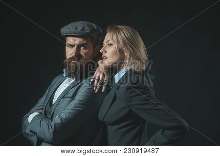 Man And Woman In Retro Suit And Hat On Dark Background. Private Investigator Concept. Couple Of Dete
