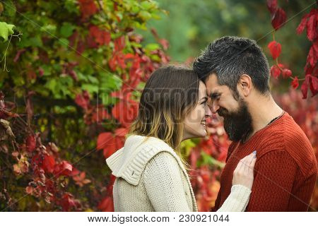 Couple With Smiling Faces Cuddle Each Other With Tenderness. Love And Romantic Concept. Couple In Lo