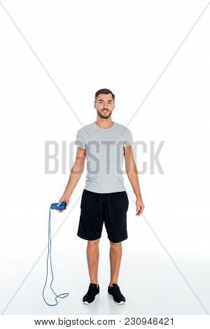 Attractive Sportsman With Jumping Rope Exercising Isolated On White