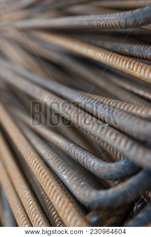 Pile Of Rusty Curved Construction Steel Rods