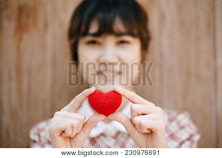 Cute Young Asia Woman Hold Red Heart On Wooden Background Vintage Colortone