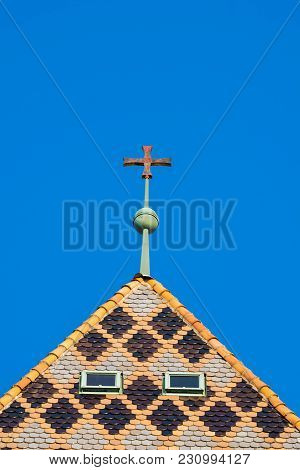 Cathedral Windows And Crucifix With A Blue Sky In Background