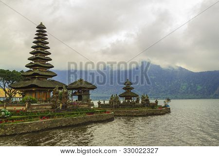 Beautiful Balinese Ulun Danau Temple On Lake Beratan In Cloudly Day In Extinct Volcano Crater In Bal