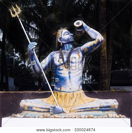 Worn Out Old Idol Of A Hindu God Lord Shiva Placed Somewhere In Anjuna Beach, Goa, India