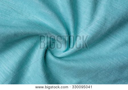 Close-up Fragment Of A Beautiful Mint Cotton Fabric. Concept Of High-quality Raw Materials For Tailo