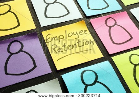 Employee Retention Sign And Figurines On The Memo Sticks.
