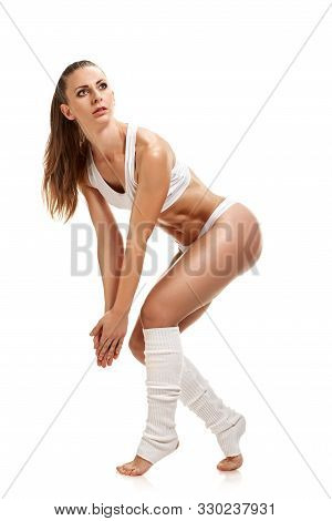 Athletic Sporty Woman Getting Ready To Training And Doing Stretching Exrcises
