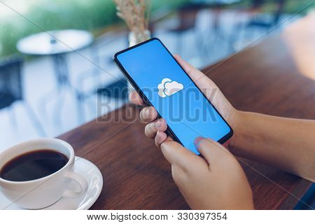 Chiang Mai, Thailand - Oct.18,2019: Woman Holding Xiaomi Mi Mix 3 With Onedrive On Screen. Microsoft
