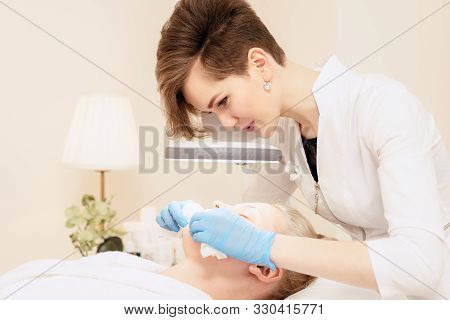 Beautician Makes Cleansing. Female Specialist Cosmetologist Removes Comedones. Spa. Healthy Lifestyl