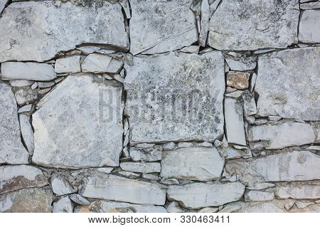 Irregularly Shaped Stone Block Wall. Background, Texture.