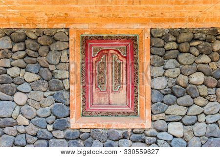 Decoration In A Stone Wall Of A Tenganan House On Bali, Indonesia