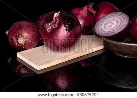 Group Of Five Whole One Half Of Tasty Onion Red On Wooden Cutting Board On Glazed Bowl Isolated On B