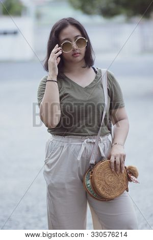 Asian Teenager Wearing Sun Glasses Standing With Self Confidence
