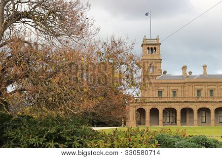 Details Of The Old World Architecture On The Grand Mansion Viewed Through The Gardens At Werribee Ma