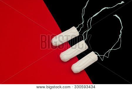 Hygienic White Tampons For Women. Cotton Swab. Menstruation, Protective Equipment. Tampons On A Blac