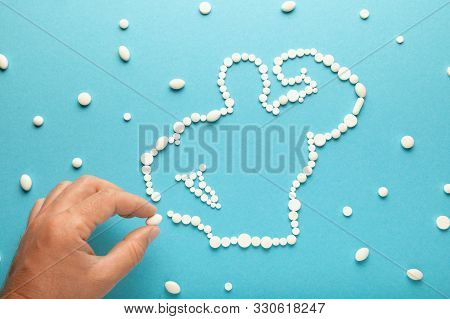 Silhouette Of Muscular Bodybuilder Made Of Pills Of Sport Meal And Supplements. Protein, Creatine, T