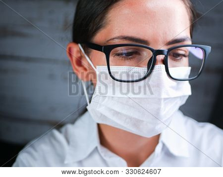 The Girl Works In The Dna Laboratory. A Young Female Technician Or Scientist Works In A Laboratory. 