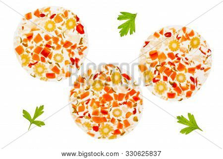 Overtop Photograph Of Three Slices Of Mixed Pickles In A. Backlit On A Light Table. Isolated On A Wh